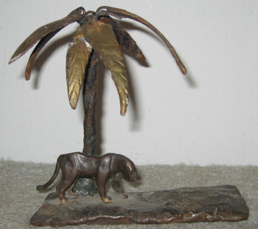 A bronze casting made with the lost wax process in the middle 1970's that I brazed onto a brass base and added a palm tree shortly after.